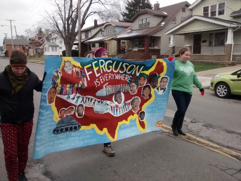 Ferguson Folks in Cleveland at March with Banner sent to Ferguson from Portland, OR